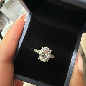 Italo oval engagement ring with hidden halo